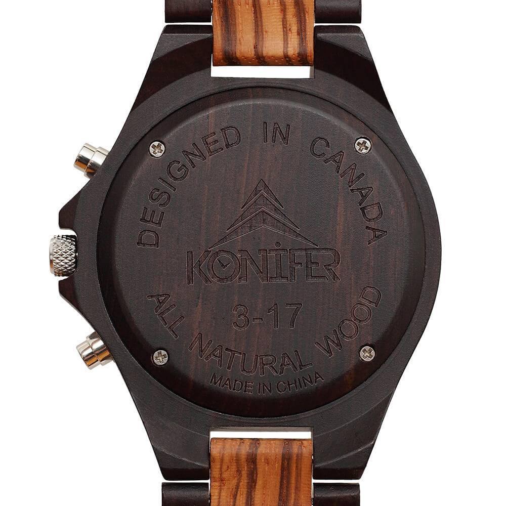 Montre en bois noir et zebre a cadran rond. Vue arriere de cadran